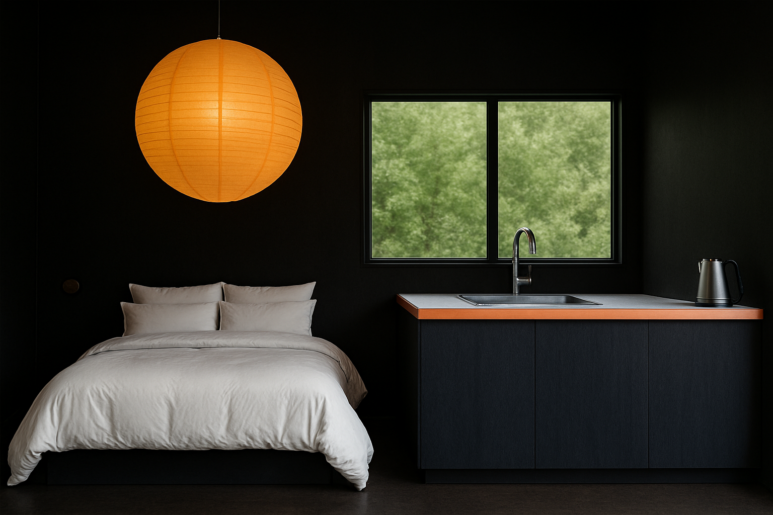 Modern bedroom with a bed, orange pendant light, and kitchen area.